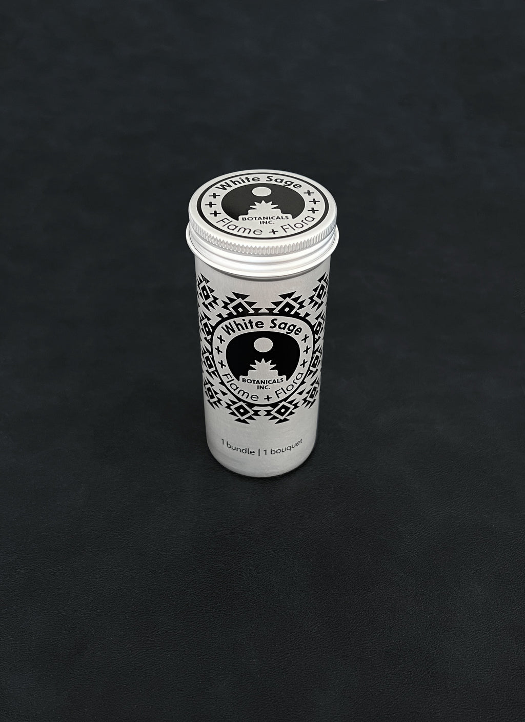 Silver metal storage tin with black patterned design for White Sage on a dark background